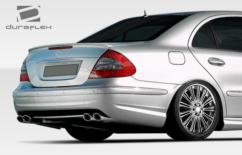 2003-2009 Mercedes E Class W211 4DR Duraflex E63 Look Rear Bumper Cover - 1 Piece / Vehicle Year Make Model Trim - 2003-2009-Mercedes E Class 4DR / Product Type - Rear Bumper / Style Name -E63 Look / Kit Material - FRP (Fiberglass Reinforced Plastics) / Notes -
