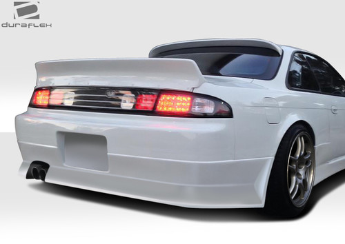 1995-1998 Nissan 240SX S14 Duraflex V-Speed Wide Body Rear Bumper Cover  (+35mm) - 1 Piece / Vehicle Year Make Model Trim - 1995-1998-Nissan 240SX ALL / Product Type - Rear Bumper / Style Name -V-Speed / Kit Material - FRP (Fiberglass Reinforced Plastics) / Notes - Note: Must be used in conjunction with entire V-Speed Widebody Kit +35mm wider front and rear
