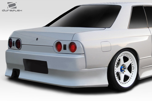 1989-1994 Nissan Skyline R32 2DR Duraflex V-Speed Rear Bumper - 1 Piece / Vehicle Year Make Model Trim - 1989-1994-Nissan Skyline 2DR / Product Type - Rear Bumper / Style Name -V-Speed / Kit Material - FRP (Fiberglass Reinforced Plastics) / Notes -