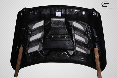 2010-2018 Dodge Ram 2500 Carbon Creations Viper Look Hood - 1 Piece / Vehicle Year Make Model Trim - 2010-2018-Dodge Ram ALL / Product Type - Hood / Style Name -Viper Look / Kit Material - Carbon Fiber / Notes - Note Hood pins are required.