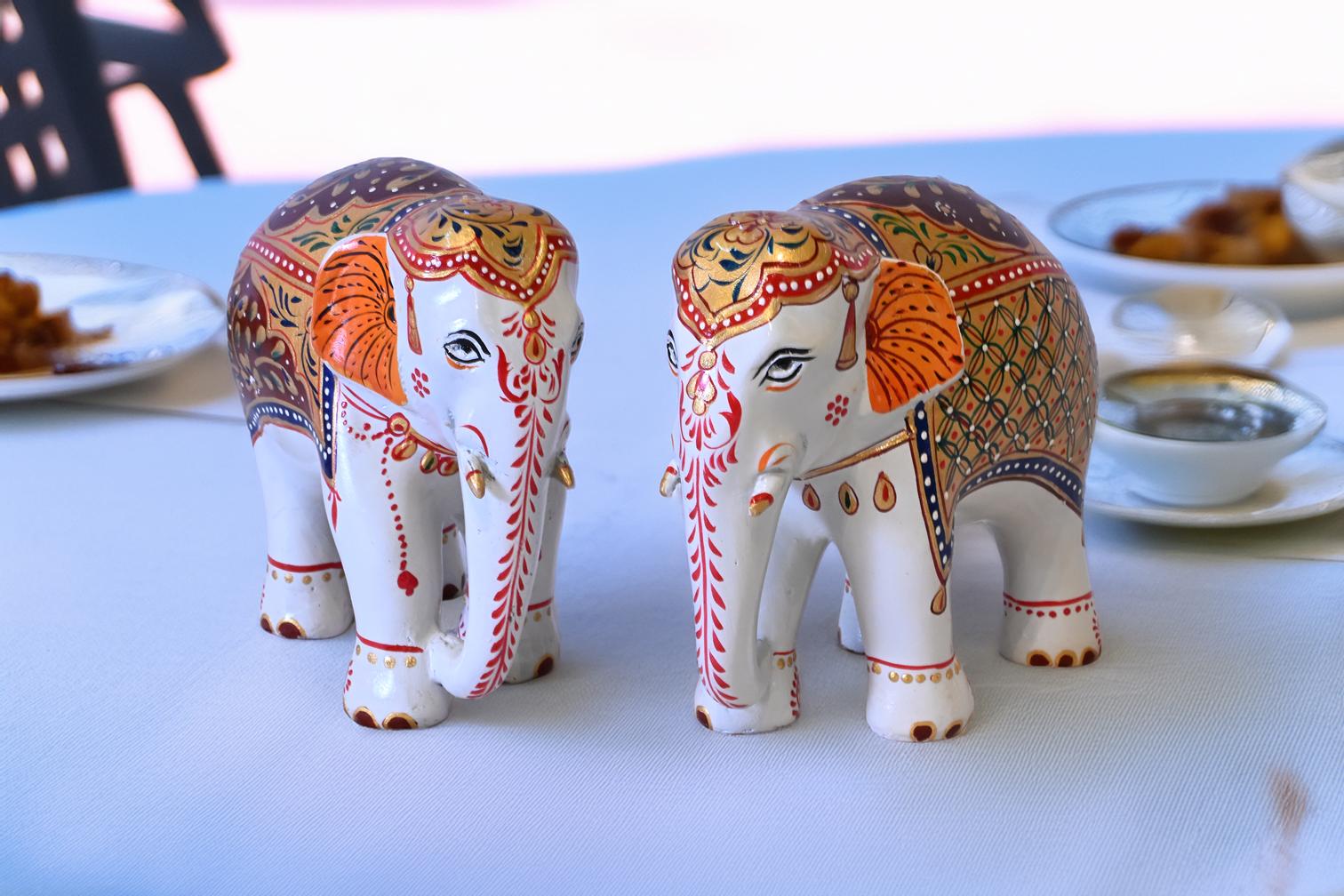 Hand-painted white Mughal elephant set of 2 with embossed artwork and decorative gift box by Kaushalam artisans.