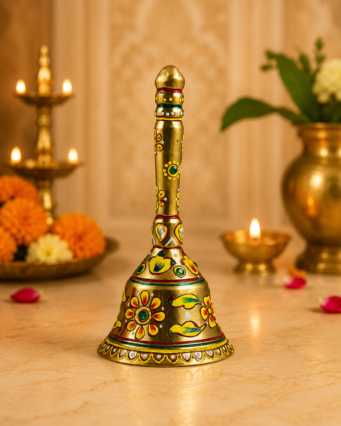 Hand-painted brass puja bell with traditional floral artwork by Kaushalam artisans, decorative prayer bell for home temple and meditation space.