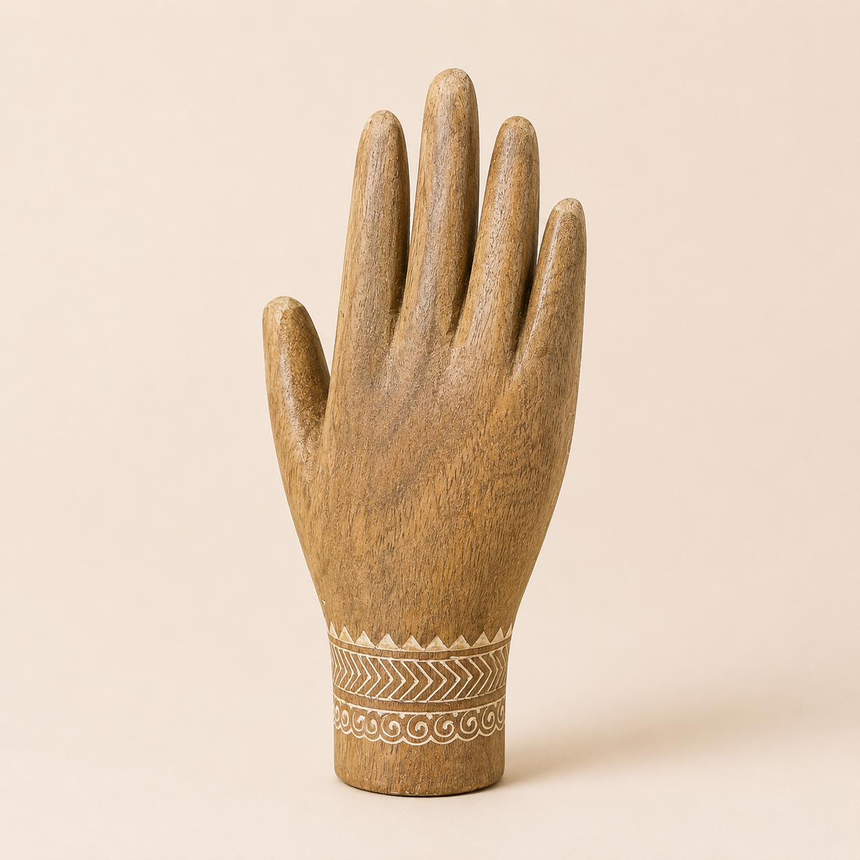 Back view of hand-carved mango wood decorative hand sculpture showing natural wood grain.
