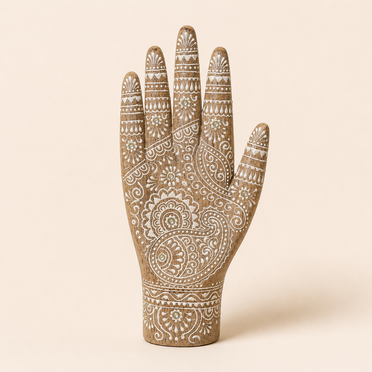 Hand-carved mango wood decorative hand sculpture with white henna art detailing on a neutral background.