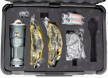 Kit includes flashlight, four high-end Lithium-ion cells, universal charger, two pairs of viewing glasses, and custom case.