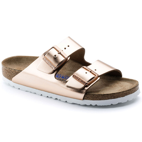 Metallic copper two strap sandal with cork footbed and soft layer over cork by Birkenstock. Metallic copper two strap sandal with cork footbed and soft layer over cork by Birkenstock.