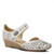 White mary jane wedge with perforated leather upper and ornate metal button.