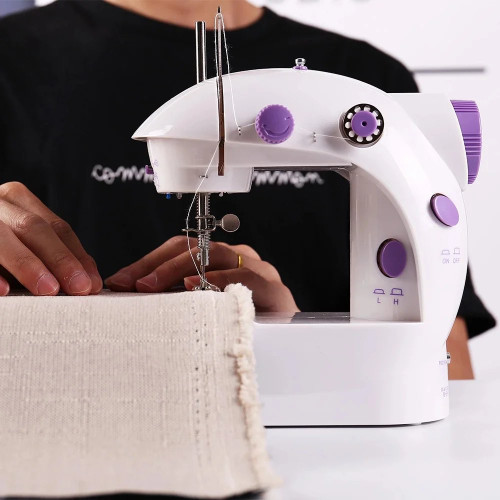 Máquina de coser eléctrica portátil · con pedal y luz