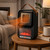 Calefactor cerámico portátil efecto chimenea · 600 W, 360°, mando