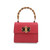 Bolso de mano de piel efecto coco con asa de bambú en color rojo