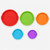 Las cinco tapas del juego de boles, en rojo, verde, naranja, azul turquesa y morado, sueltas sobre fondo claro