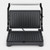 Grill de contacto negro y plata abierto en vertical, con sus dos placas estriadas y el asa de barra plateada