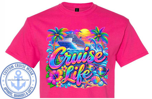 The image displays a vibrant, tropical graphic printed on a bright pink t-shirt. The graphic is centered on the chest of the t-shirt and depicts a lively scene associated with cruising.

The main elements include a large cruise ship sailing on blue, choppy waves. To the left and right of the ship, there are two palm trees with green fronds and coconuts. The sky behind the ship is a warm gradient of yellow, orange, and purple, suggesting a sunset or sunrise, with a bright yellow sun prominently featured. Two dolphins are leaping out of the water on the right side of the graphic, adding a sense of dynamism.

Below the cruise ship and dolphins, the words "Cruise Life" are emblazoned in large, colorful, bubble-style lettering. The letters are filled with a rainbow gradient of colors, outlined in black with a shimmering, iridescent effect. The word "Cruise" is positioned above "Life."

Further down, resting on a sandy beach, are several accessories related to a tropical vacation. These include a pair of stylish sunglasses with reflections of palm trees and a sunset in the lenses, a bright pink hibiscus flower, a smaller yellow plumeria flower, a starfish, a sand dollar, and several seashells of varying shapes and colors. The beach itself has a light sandy texture.

The overall color palette is very rich and saturated, dominated by the bright pink of the t-shirt which serves as a strong background. The graphic itself features a wide array of bright colors including blues, greens, yellows, oranges, purples, and pinks, creating a festive and tropical atmosphere. There are also subtle light blue water splashes around the ship and dolphins.

The composition is busy and detailed, filling the central area of the t-shirt. The elements are arranged to create a sense of depth and visual interest, with the ship and text forming the central focus, and the surrounding elements contributing to the overall theme.

In the bottom left corner of the t-shirt, there is a circular logo for "CUSTOM CRUISE WEAR". The logo is predominantly light blue and features an anchor in the center. Around the anchor, it reads "CUSTOM CRUISE WEAR" in an arc, and below that, "APPAREL, BANNERS & GIFTS". The website "www.CustomCruiseWear.com" is also displayed inside the anchor. This logo is printed on the t-shirt itself, separate from the main graphic.

The t-shirt appears to be made of cotton and has a crew neck. The pink color is solid and uniform across the garment. There are subtle watermarks or copyright notices overlaid on the graphic, which are semi-transparent text repeating "COPYRIGHT DO NOT COPY - CUSTOM CRUISE WEAR".