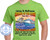 The image shows a light green t-shirt with a graphic design printed on the front. The design features text, a cruise ship, and a cityscape. The overall color scheme is vibrant, with oranges, yellows, blues, and whites dominating the graphic.

At the top of the graphic, in large, stylized, multi-colored font, is the text "Exploring The Mediterranean Cruising On The Glory". The words "Exploring The Mediterranean" are in a dark green, almost black, cursive font. "CRUISING ON THE GLORY" is much larger, with "CRUISING ON THE" in a bold, orange outline with a yellow fill, and "GLORY" in a larger, more elaborate font with a red and orange gradient fill and a yellow outline. Below this, in a smaller, simpler font, is the phrase "Name Here".

The central part of the design depicts a cruise ship sailing on blue water. The ship is white with blue accents and red lifeboats visible along its side. The water has a textured, wavy appearance with reflections. Behind the ship, on the left side of the graphic, is a cityscape that appears to be a European architectural style, possibly depicting buildings from Spain such as Sagrada Familia. The buildings have intricate details and vibrant colors, with spires and balconies. The background behind the cityscape and ship features a sunset with streaks of orange and yellow, giving a warm glow.

Below the image of the ship and cityscape, in large, bold, orange outlined text with a yellow fill, is the phrase "13 DAY TRANSATLANTIC JOURNEY".

Underneath this, in black text, is a list of destinations: "Barcelona, Spain - Alicante, Spain - Malaga, Spain Gibraltar (U.K.) - Grand Bahamas - Port Canaveral, FL".

Finally, at the bottom of the graphic, in black text, are the dates "April 11-24, 2026".

In the lower left corner of the t-shirt graphic, there is a circular logo for "CUSTOM CRUISE WEAR". The logo is blue and white and features an anchor in the center with the text "CUSTOM CRUISE WEAR" around the top circumference and "APPAREL, BANNERS & GIFTS" around the bottom circumference, with stars on either side. The website "www.CustomCruiseWear.com" is also visible within the logo.

There are numerous semi-transparent watermark-like text overlays throughout the design, such as "COPYRIGHT - DO NOT COPY", "CUSTOM CRUISE WEAR", which are typical for stock images or designs intended for use on merchandise.

The composition of the graphic is balanced, with the text and imagery arranged to capture attention and convey the theme of a Mediterranean cruise. The use of bright colors and bold fonts makes the design eye-catching and celebratory. The image is centered on the t-shirt, which is worn by a person whose torso is visible, but their face and lower body are not in the frame.