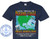 The image displays a dark navy blue t-shirt with a graphic design printed on the front. The design is centered and occupies a significant portion of the t-shirt's chest area.

The main title of the graphic reads "SAILING THROUGH THE PANAMA CANAL" in large, stylized lettering. "SAILING THROUGH THE" is in a white serif font, while "PANAMA CANAL" is in a bolder, gradient font that transitions from yellow at the top to orange and red at the bottom, suggesting fire or heat.

Beneath the title is a map of the Caribbean and Central America, rendered in muted blues and greens, with gray outlines for the landmasses. Overlaid on the map are numerous instances of "COPYRIGHT - DO NOT COPY - CUSTOM CRUISE WEAR" repeated in a light gray, semi-transparent font, forming a watermark effect. A compass rose is visible in the upper right portion of the map.

Two postage stamp-like images are superimposed on the map. The top stamp depicts a cruise ship navigating through what appears to be a canal or lock system, with water and surrounding structures visible. The bottom stamp shows a similar scene, possibly a different part of the canal, with a cruise ship and some dock elements. Both stamps have a slightly aged, textured appearance.

Below the map and stamps, a secondary title reads "MIRACLE JOURNEYS CRUISE" in large, bold, yellow lettering. Beneath this, a list of cruise destinations is provided in a smaller white font: "TAMPA - GRAND CAYMAN - CARTAGENA - PANAMA CANAL - PUNTARENAS - CABO SAN LUCAS - SEATTLE".

At the very bottom of the graphic, a date is displayed in a large, bold white font: "APRIL 11 - 27, 2026". This date also has the same repeating "COPYRIGHT - DO NOT COPY - CUSTOM CRUISE WEAR" watermark effect around it.

To the left of the main graphic, there is a circular logo. This logo is light blue and features an anchor icon in the center. Around the anchor, the text "CUSTOM CRUISE WEAR" is written in a curved arc at the top, and "APPAREL, BANNERS & GIFTS" is in a similar arc at the bottom. The website "www.CustomCruiseWear.com" is written horizontally below the anchor. The circular logo is also framed by small star icons.

The t-shirt itself is a standard crew neck style, and the fabric appears to be a soft cotton material. The overall color palette of the graphic is dominated by blues, greens, yellows, oranges, and reds, contrasted against the dark navy of the t-shirt and the gray watermark. The composition is layered, with text and images placed over a map background, creating a visually rich and informative design related to a cruise.