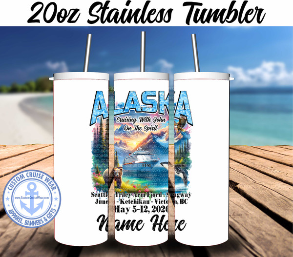 Alaska mountains with a beach has bear on bank, whale in water with a blue ship in the center.  Alaska across the top with the cruise itinerary and sail dates on a tumbler