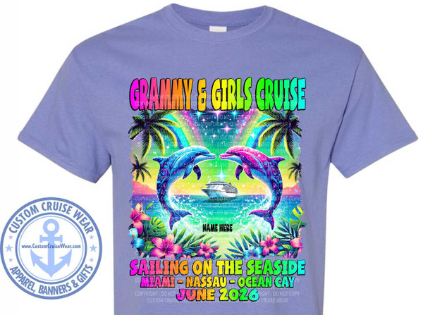 The image displays a lavender t-shirt with a vibrant graphic design centered on the chest. The design features a tropical cruise theme.

At the top, in large, colorful, block letters with an ombre effect from purple to green to blue, reads "GRAMMY & GIRLS CRUISE".

Below the title, a scene unfolds with two dolphins, one blue and one pink, leaping in the water, their bodies arching towards each other. They are surrounded by splashes of water. In the background, behind the dolphins, a cruise ship is visible sailing on the ocean. Above the cruise ship, a rainbow arcs across a starry, colorful sky, with stylized palm trees on either side of the scene. Lush tropical foliage, including large hibiscus flowers in pink and purple, and green palm fronds, frames the bottom of the graphic.

Centrally located between the dolphins is the text "NAME HERE" in a bold, white, sans-serif font.

Below the dolphins and foliage, more text appears in large, bold letters. The first line reads "SAILING ON THE SEASIDE" in a gradient of purple to orange. The second line, in a similar gradient from orange to yellow, states "MIAMI - NASSAU - OCEAN CAY". The date "JUNE 2026" is prominently displayed in a bright yellow font with a green outline.

On the left side of the t-shirt, within the graphic area, there is a circular emblem with the words "CUSTOM CRUISE WEAR" around the perimeter. Inside the circle is an anchor symbol, and below it, the website address "www.CustomCruiseWear.com". The emblem has a distressed or faded effect.

Throughout the graphic, there are faint, repeated watermark-like text overlays that say "COPYRIGHT - DO NOT COPY CUSTOM CRUISE WEAR". These are most noticeable on the cruise ship and in the background sky.

The overall color palette is bright and cheerful, utilizing blues, purples, pinks, greens, yellows, and oranges, evoking a summery and celebratory mood associated with a cruise vacation. The composition is symmetrical, with the dolphins and cruise ship as the focal point, balanced by the text and tropical elements. The t-shirt itself is a light purple or lavender color, providing a soft backdrop for the graphic.