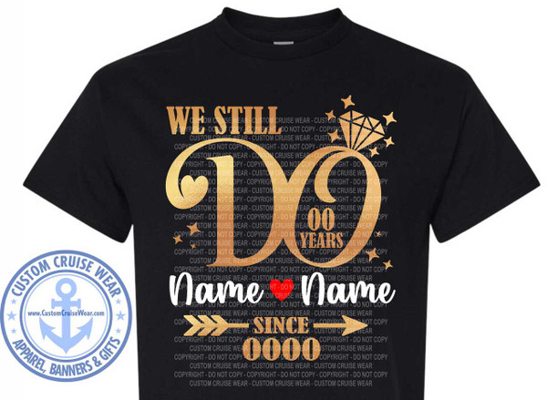 The image is a black t-shirt featuring a metallic gold graphic design. The design is centered on the chest of the shirt. The main element of the design is a large, stylized number "60", with the "6" having a heart shape cut out of its upper left portion. To the right of the "60", there is a diamond shape with smaller star shapes radiating outwards. Above the "60", the text "WE STILL" is displayed in a blocky, sans-serif font. Below the "60", the text "00 YEARS" is prominent, with "00" being significantly larger than "YEARS". In the center of the design, below "00 YEARS", there are two placeholder names, "Name" in white text, separated by a small red heart, followed by another "Name" in white text. Below the names, there is an arrow graphic pointing to the right, with the word "SINCE" in gold text. Below "SINCE", there is a placeholder for a year, represented as "0000" in gold text. The entire graphic is overlaid with a semi-transparent watermark that repeats the phrase "CUSTOM CRUISE WEAR - COPYRIGHT - DO NOT COPY" in a vertical pattern. To the left of the main graphic, there is a circular emblem. This emblem features a navy blue border with the text "CUSTOM CRUISE WEAR" curved along the top and "APPAREL, BANNERS & GIFTS" curved along the bottom. Inside the border, there is a light blue anchor symbol on a white background, with the website address "www.CustomCruiseWear.com" also in light blue text. The t-shirt itself is black, and the graphic elements are predominantly metallic gold, with white and red accents for the names and heart. The composition is balanced, with the primary graphic centered and the emblem placed to the lower left. The overall aesthetic suggests a design for a wedding anniversary or a significant milestone, possibly related to a cruise vacation, given the branding.