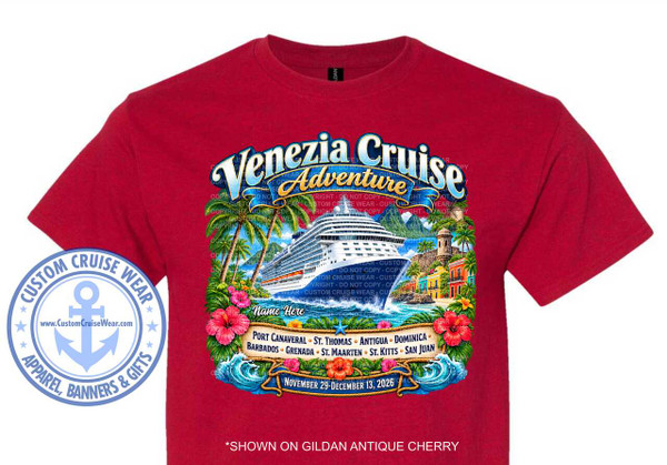 The image displays a close-up of a dark red t-shirt with a colorful graphic design printed on the front. The t-shirt fabric appears to be a soft cotton blend, with visible stitching and texture. The overall design is a vibrant tropical scene depicting a cruise adventure.

The central element of the graphic is a large, white cruise ship with blue accents, sailing on a choppy, turquoise sea. The ship is shown from a slight angle, appearing to be approaching a tropical coastline. The water is depicted with frothy white waves, suggesting movement and spray.

To the right of the ship, a quaint, colorful coastal town is illustrated. The buildings are painted in bright yellows, oranges, and blues, with red-tiled roofs. A historic-looking stone tower or fort with arched windows is prominent, overlooking the harbor. Tropical palm trees with lush green fronds frame the scene from the left and right sides of the graphic. Pink and red hibiscus flowers are scattered amongst the foliage, adding pops of vibrant color.

Above the cruise ship and town, a stylized banner in shades of blue and yellow proclaims "Venezia Cruise Adventure" in a decorative, flowing font. The word "Venezia" is in a larger, lighter blue with a white outline, while "Cruise Adventure" is in a slightly smaller, darker blue with a yellow outline.

Below the ship and town, a textured rope border frames a banner displaying the cruise itinerary. The banner lists several port names in white text, separated by small black dots: "PORT CANAVERAL", "ST. THOMAS", "ANTIGUA", "DOMINICA", "BARBADOS", "GRENADA", "ST. MAARTEN", "ST. KITTS", "SAN JUAN".

At the very bottom of the graphic, a dark blue banner with white text indicates the cruise dates: "NOVEMBER 29 - DECEMBER 13, 2026". A small blue star is placed just above the dates.

On the left side of the t-shirt, a circular emblem is printed. This emblem features a light blue anchor within a circle, surrounded by a darker blue border. Text in the border reads "CUSTOM CRUISE WEAR" at the top and "APPAREL, BANNERS & GIFTS" at the bottom, with small blue stars separating these phrases. A website address, "www.CustomCruiseWear.com", is visible inside the central anchor circle.

The color palette of the graphic is rich and tropical, dominated by blues of the ocean and sky, vibrant greens of the foliage, and the bright, warm colors of the buildings and flowers. The cruise ship is primarily white and blue, standing out against the colorful background. The text elements are generally in white, yellow, and blue, ensuring readability.

The composition is balanced, with the cruise ship as the main focal point, supported by the surrounding tropical elements. The arrangement guides the viewer's eye from the title at the top, down through the scene to the itinerary and dates at the bottom. The circular emblem on the left serves as a secondary branding element.

Subtle details include the white spray of the waves, the texture of the rope border, and the small dots separating the port names. Watermarks appear to be present throughout the graphic, indicating copyright. At the bottom of the t-shirt, outside the main graphic, text in white reads "SHOWN ON GILDAN ANTIQUE CHERRY", indicating the specific t-shirt color and brand.