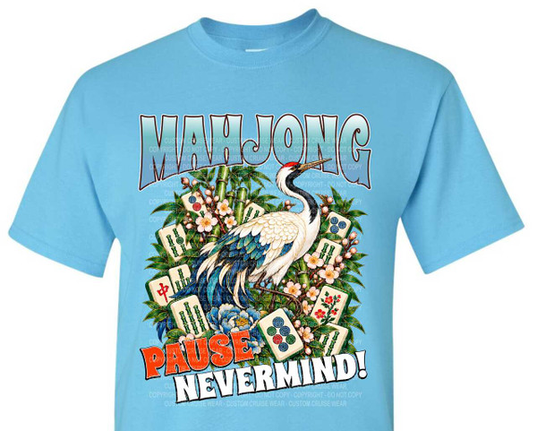 The image is a graphic design printed on a light blue t-shirt. The graphic depicts a scene with a large, ornate crane as the central element. The crane is white with striking blue and black feather accents, a red cap on its head, and a long, elegant neck and body. It stands amidst a vibrant arrangement of mahjong tiles, bamboo stalks, and blooming flowers.

The mahjong tiles are a mix of different suit symbols and numerical markings, some featuring green bamboo, red Chinese characters, and circular designs in red, blue, and green. They are scattered and layered around the crane, some lying flat, others angled. The bamboo stalks are depicted in various shades of green and are upright, providing a vertical element to the composition. The flowers are delicate and small, with pale pink and white petals, interspersed with buds, and a larger, detailed blue peony or lotus at the base. Lush green leaves frame the entire arrangement, creating a sense of fullness and natural beauty.

Above the central scene, the word "MAHJONG" is written in large, stylized letters. These letters are shaded with a gradient of light blue to white, outlined with a dark border, and have a slightly wavy, almost bubbly appearance, giving them a playful feel.

Below the central scene, two lines of text are presented in bold, contrasting fonts. The top line reads "PAUSE" in a fiery orange-red color with a darker outline, while the bottom line reads "NEVERMIND!" in a crisp white color with a black outline. The text is angled slightly, adding dynamism to the design.

The background of the graphic is a lighter shade of blue than the t-shirt itself, creating a subtle contrast. There are numerous faint, repeating watermark-like text overlays throughout the graphic, most notably "CUSTOM CRUISE WEAR - DO NOT COPY - COPYRIGHT". These watermarks are in a light grey and are very subdued.

The composition is centered on the t-shirt, with the graphic filling a significant portion of the chest area. The crane is positioned slightly to the right of the center, with its head turned towards the left. The arrangement of mahjong tiles, bamboo, and flowers creates a circular or oval frame around the crane and text. The overall color palette is rich and detailed, combining the cool blues of the t-shirt and lettering with the earthy greens, vibrant reds and oranges of the tiles and text, the delicate pastels of the flowers, and the striking white, black, and blue of the crane. The style is illustrative and detailed, with a blend of Eastern cultural motifs and a playful, modern design.