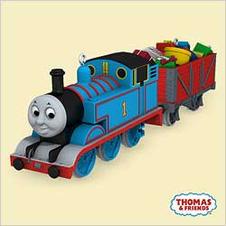 A colorful illustration of Thomas the Tank Engine on train tracks in a grassy landscape with