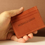 Image of a cardholder in hands