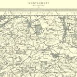 Close up of authentic reproduction of Ordnance Survey map of Montgomery 1896-1904 with a yellow tint background