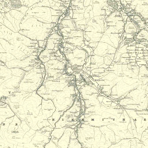 Close up of authentic reproduction of Ordnance Survey map of Tomintoul 1896-1904 with a yellow tint background
