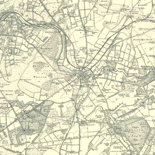Close up of authentic reproduction of Ordnance Survey map of Thetford 1896-1904 with a yellow tint background