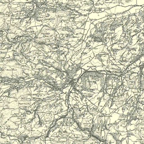 Close up of authentic reproduction of Ordnance Survey map of Llanidloes 1896-1904 with a yellow tint background