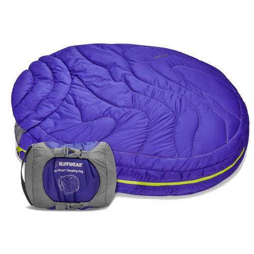 Ruffwear Highlands Dog Sleeping Bag in blue in front there is the carry case that has a sleeping bag packed inside