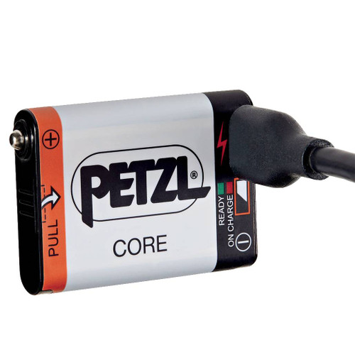Petzl Core Battery with the charging cable plugged into the port for use in Petzl headlamps