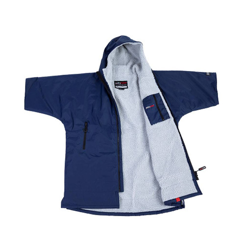 Dryrobe Advance Kids Navy Short Sleeve Outdoor Robe outstretched and laid on a flat surface with the left side folded back showing the grey inside waterproof zip pocket & label