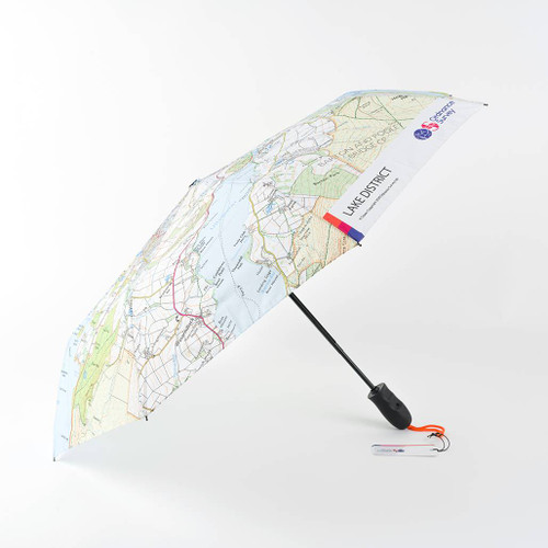 OS Lake District Umbrella by Ordnance Survey fully open and leaning to the left hand side showing it's black handle