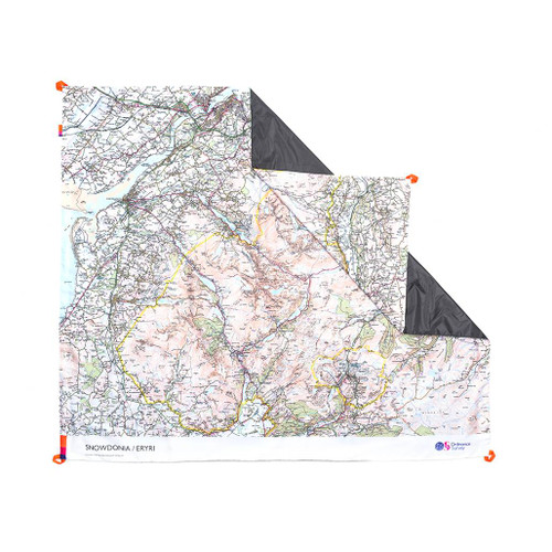 The OS Snowdonia Picnic Blanket by Ordnance Survey Outdoor Kit front view of the blanket with the corner turned down to show the waterproof back