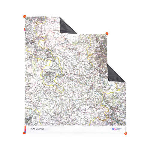The OS Peak District Picnic Blanket by Ordnance Survey Outdoor Kit front view of the blanket with the corner turned down to show the waterproof back