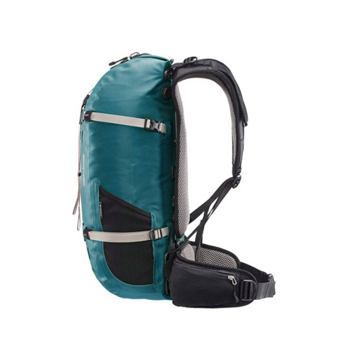Ortleib Atrack 25 litre petrol blue waterproof backpack packed full to show the size from side and including the lateral pocket middle
