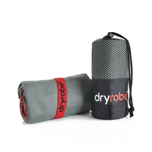 Dryrobe Micro Fibre Towel in light grey rolled up and ready to go strapped into it's band with another micro fibre towel in its mesh bag standing up.
