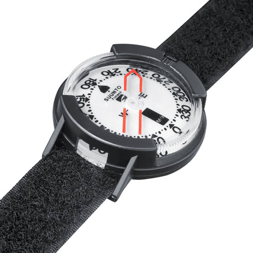 The Suunto M-9 Wrist Compass tilted to show the strap and side viewer for bearings with black Velcro strap