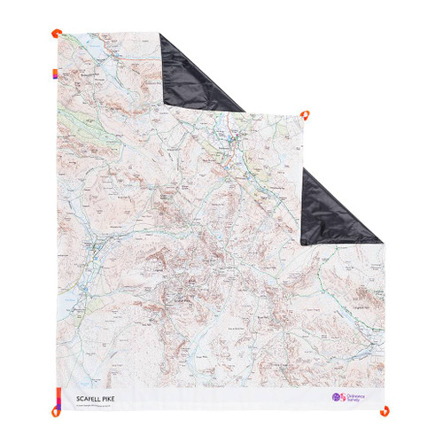 The OS Scafell Pike Picnic Blanket by Ordnance Survey Outdoor Kit front view of the blanket with the corner turned down to show the waterproof back