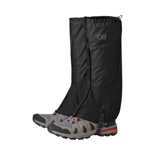 Outdoor Research Men's Helium Gaiters in black with OR logo buckled under walking shoes and hooked to boot laces
