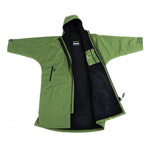 Dryrobe Advance Adults Green Long Sleeve Outdoor Robe outstretched and laid on a flat surface with the left side folded back showing the black inside waterproof zip pocket & label