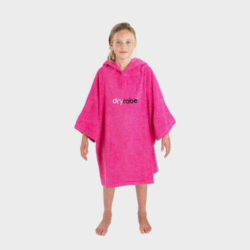 Child wearing the Dryrobe Organic Towelling Kids Pink Robe facing front