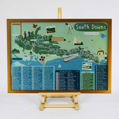 Full view of a framed map of the South Downs Scratch Off Map on an easel