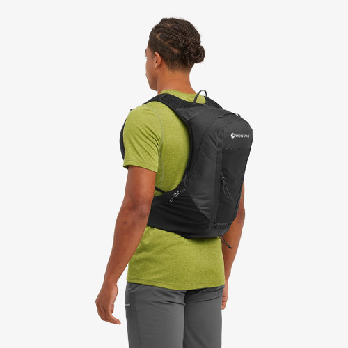 A person wearing  the Montane Men's Trailblazer 18 Backpack in black, showing the front of the pack