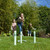 3 Children playing a game of Horseshoe pitching weith the Traditional Garden Games Garden horseshoe pitching game