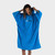 Person standing wearing the dryrobe Organic Towelling Cobalt Blue Robe and putting the hood up in motion