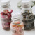 3 ingredient bottles including Enchanted Seeds, Crystals and Dried Raindrops from the Making Potions: Enchanted Garden Kids Activity Kit by The Curious Bear