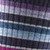Close up of the grip on the Women's Decade Stripe Micro Crew Midweight Socks by Darn Tough in Blackberry purple, blue and grey stripes