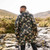 Person wearing Mac in a Sac Origin 2 Adult Camo Poncho facing away from the camera to give a full view of the back